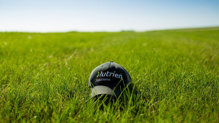 Nutrien Ag Solutions hat in green grass
